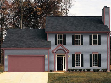 dark grey house with metal roof|black roof with gray siding.